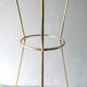 Tripod healing in gold metal and perforated metal from the 1960s