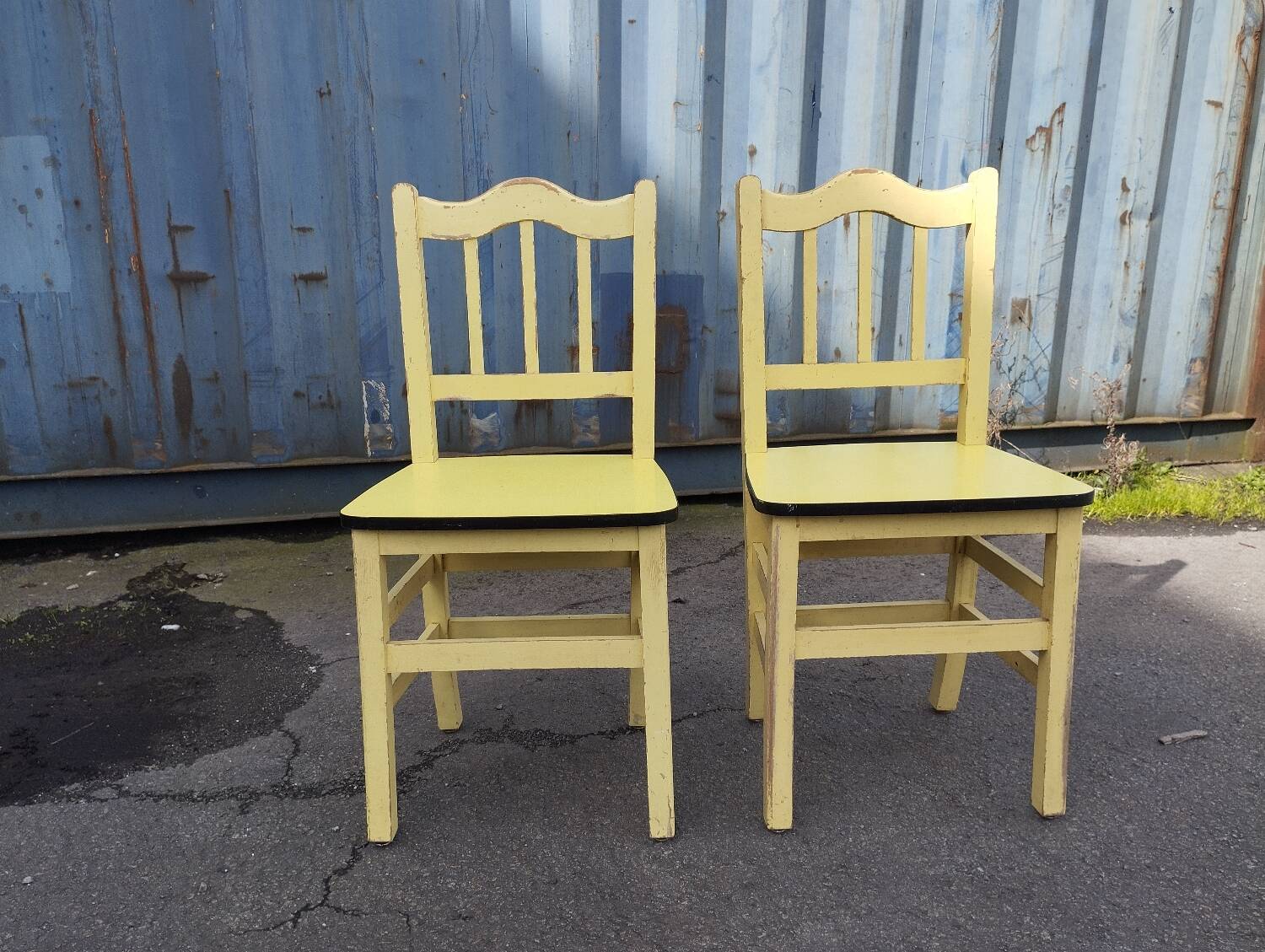 Pair of wooden and yellow formica chairs