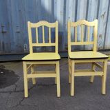Pair of wooden and yellow formica chairs