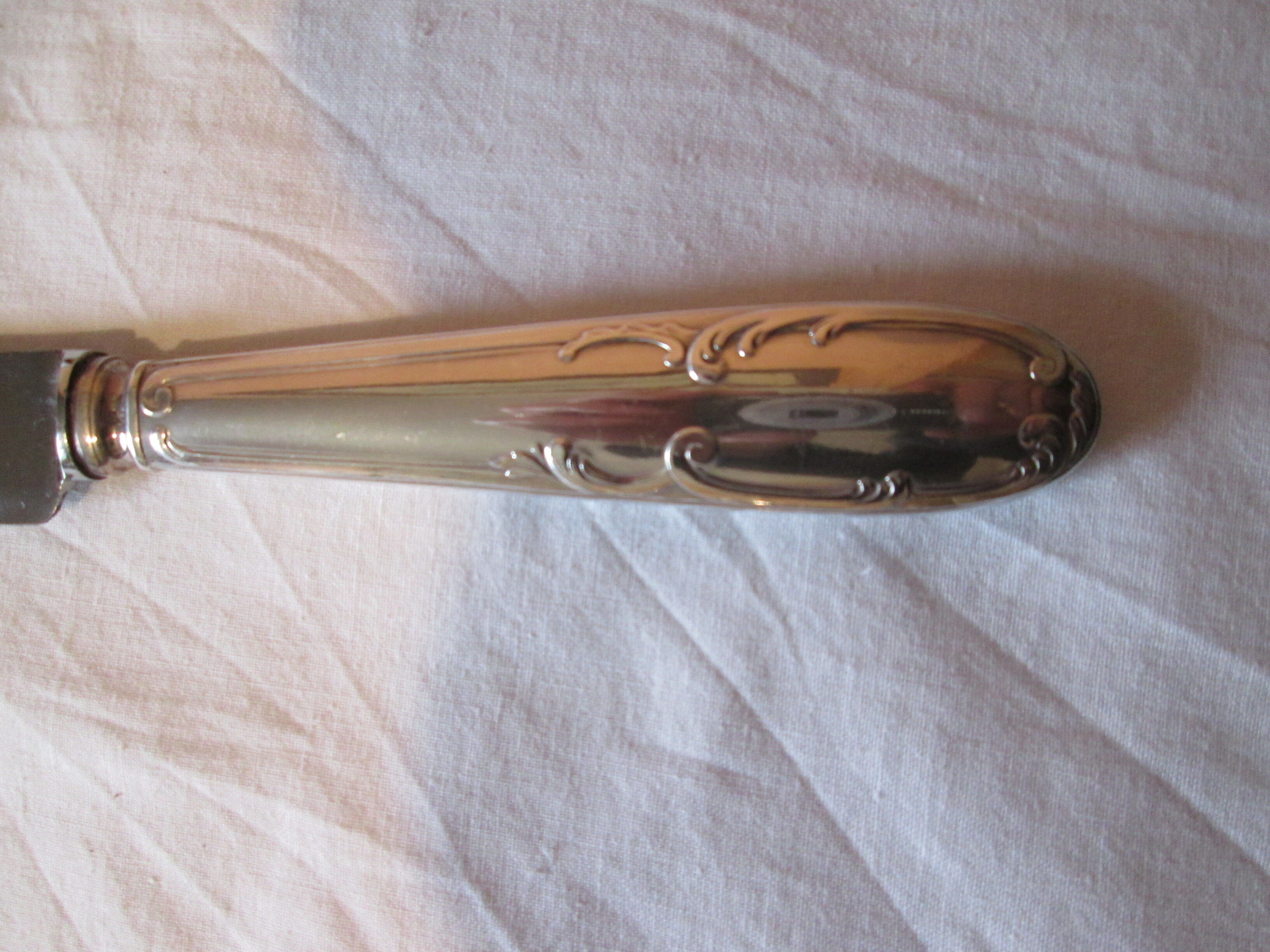 12 silver metal knives