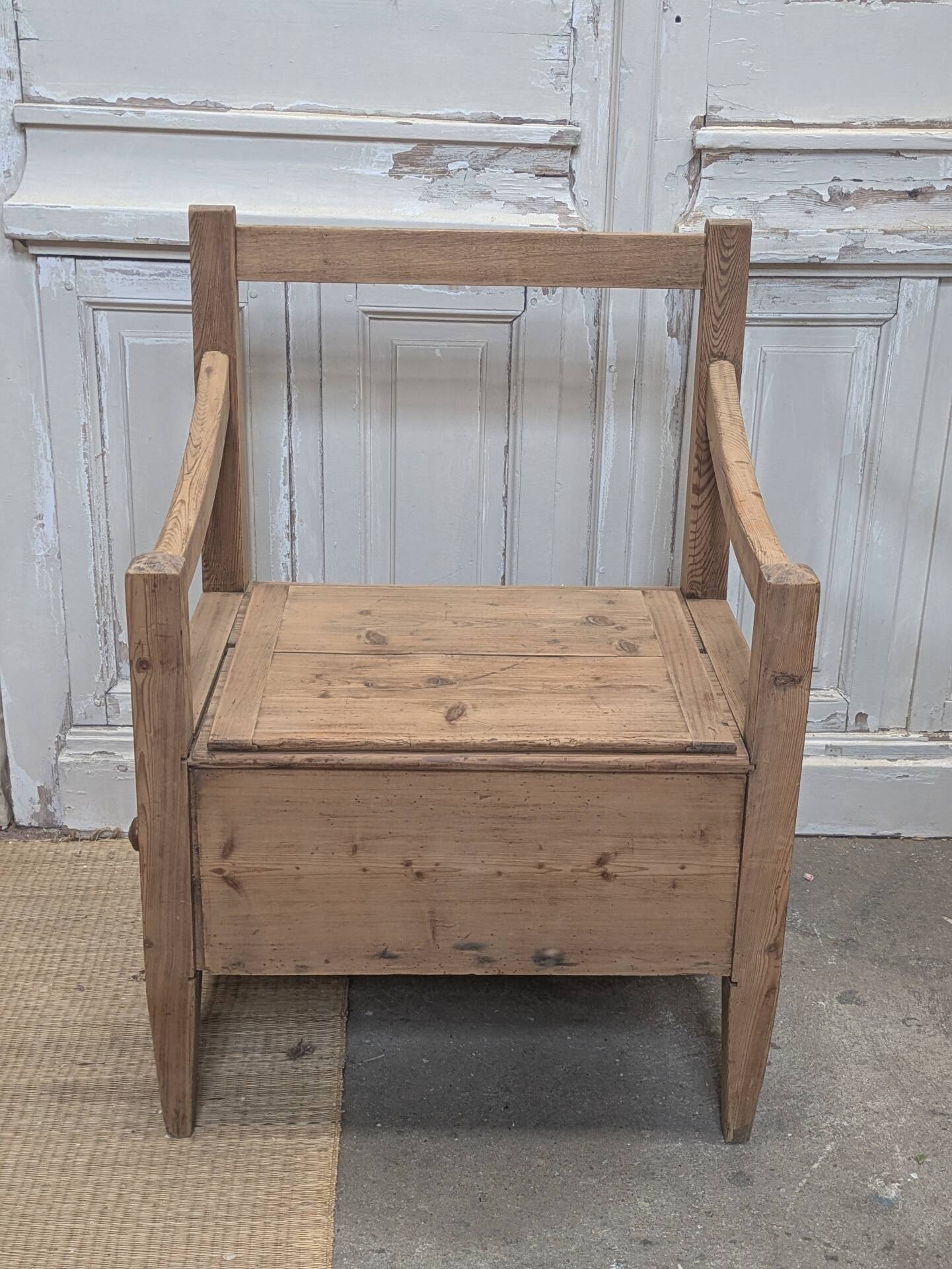 Antique armchair in raw wood