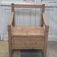 Antique armchair in raw wood