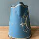 Old painted sheet metal jug or milk jug