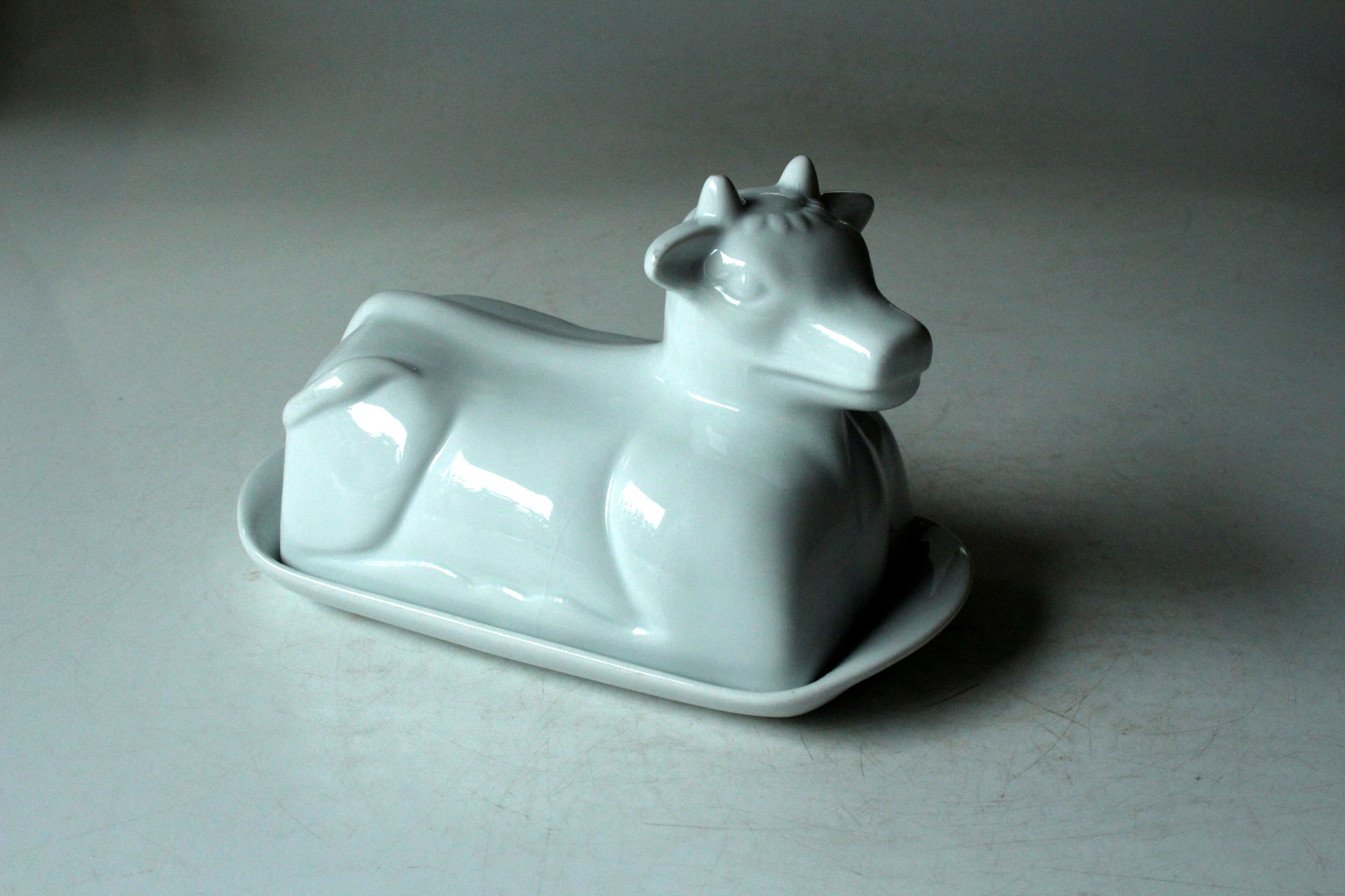 White ceramic butter dish in the shape of a cow, vintage