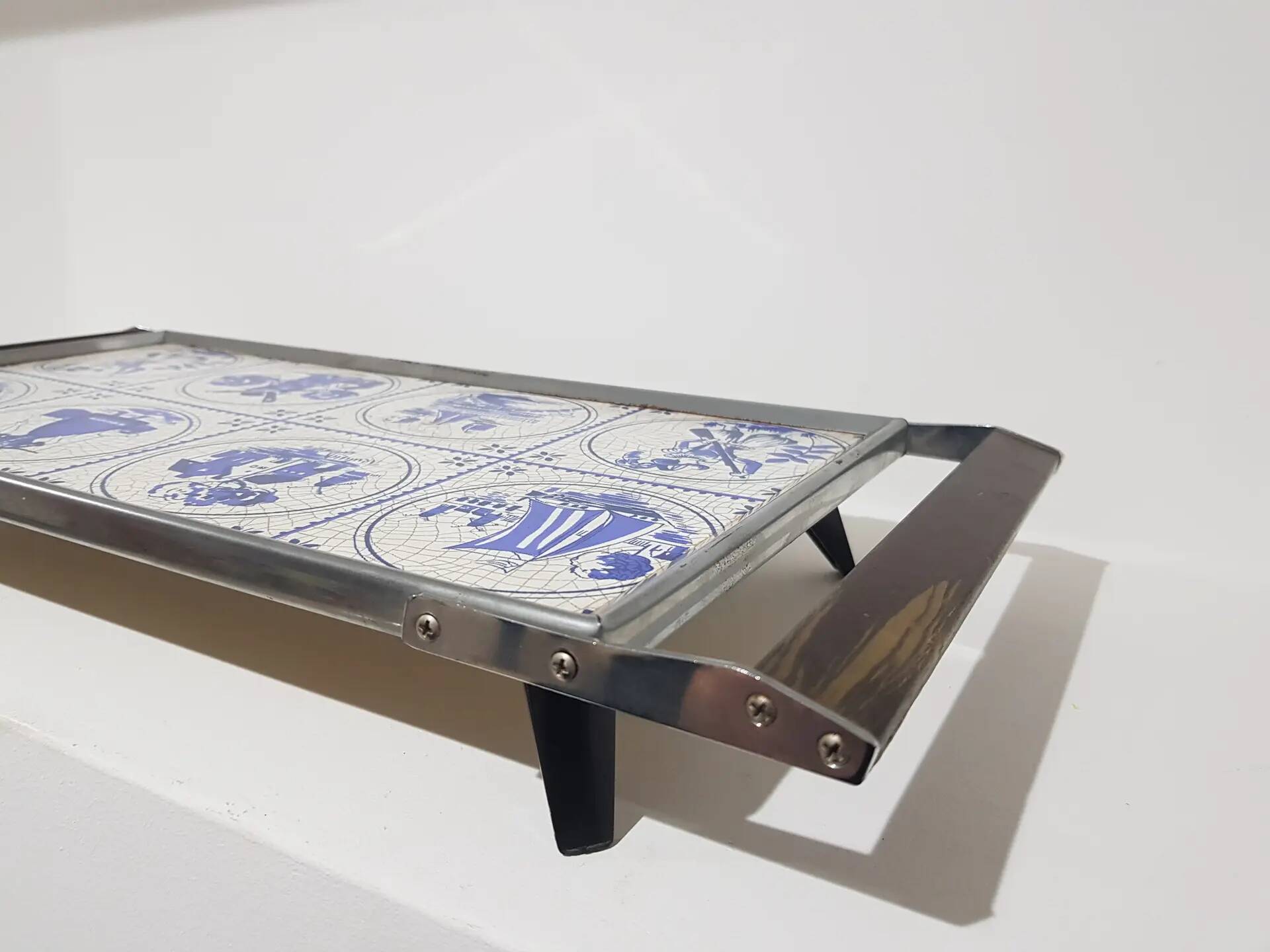 Heating plate, blue and white ceramic, brown rosewood, black metal, Germany, 1970s.