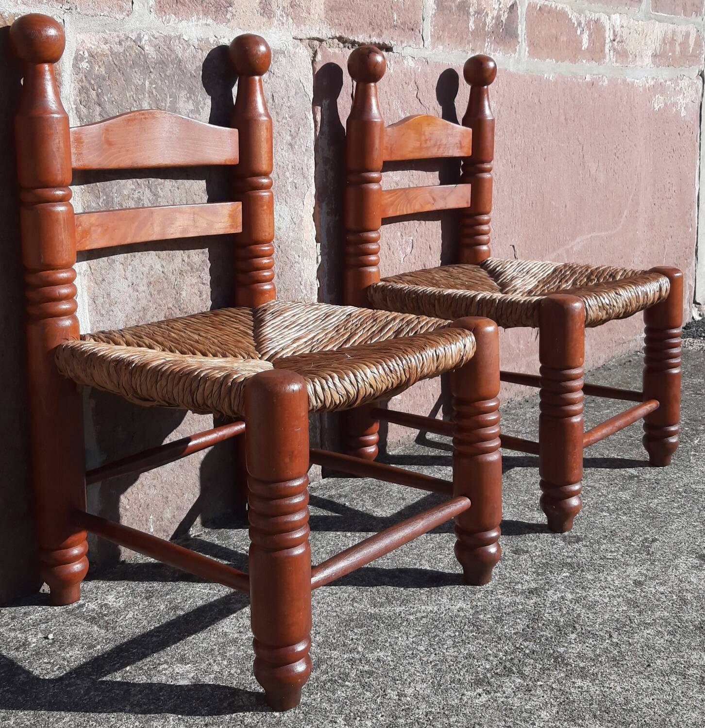 Pair of low armchairs by the fireplace. (Straw seat)