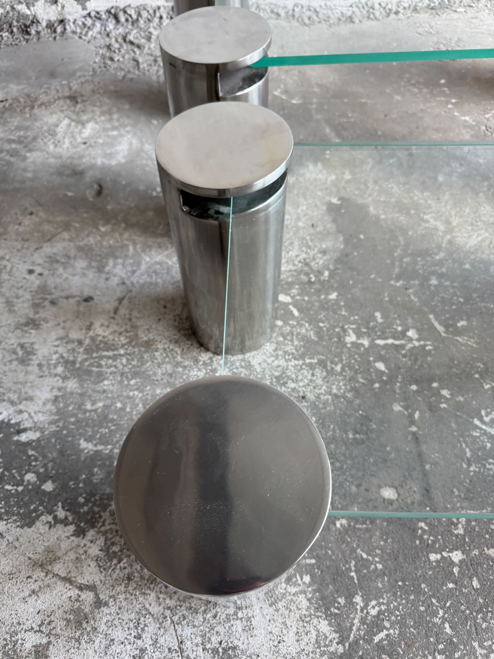 Pair of modernist coffee tables with cylindrical steel legs