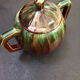 Large service in green and brown glazed stoneware with facets, signed Louis Cag.