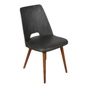 Vintage chair from the 50s-60s with foam padding and faux leather upholstery.