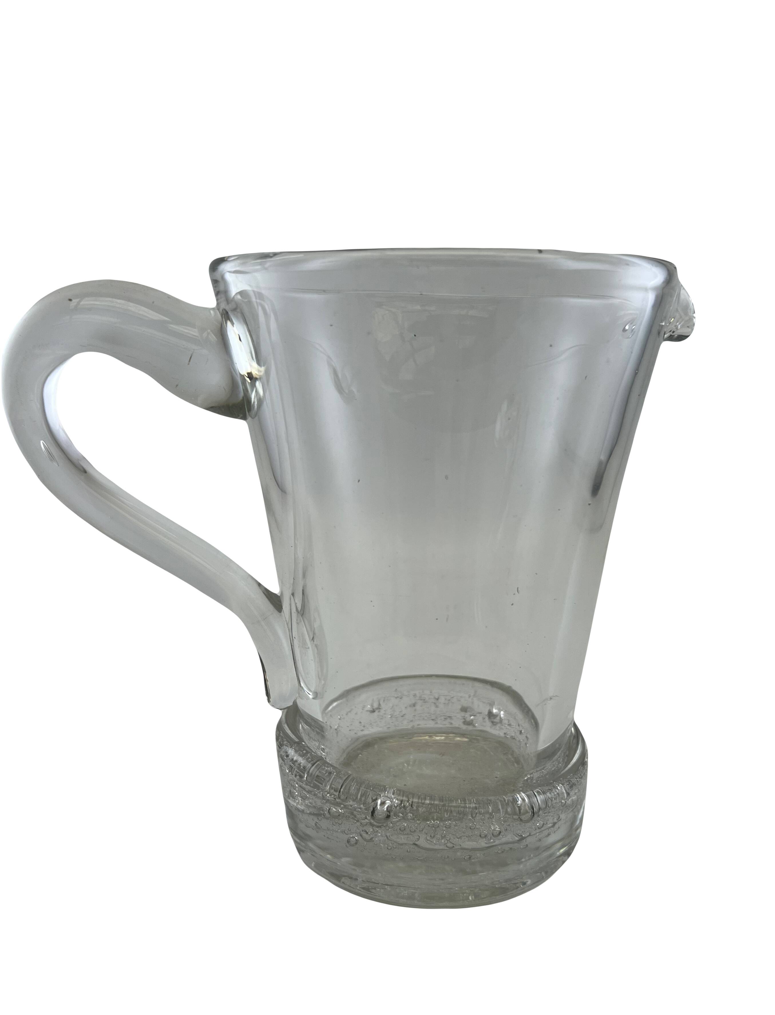 Large stylized glass pitcher