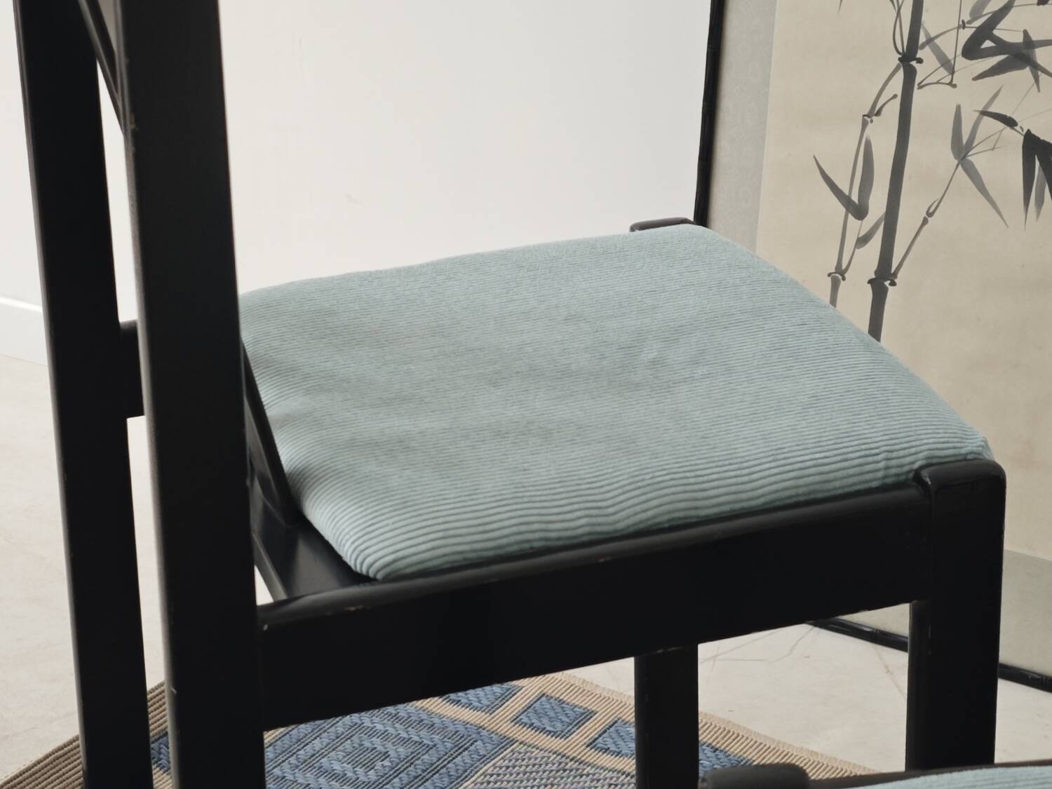 Set of 4 modernist black chairs with light blue ribbed fabric