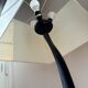 Pair of hammered black metal floor lamps with white shades.
