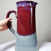 Large artistic stoneware vase by Lévéjac Michel Goldstyn, with flamed oxblood glaze.