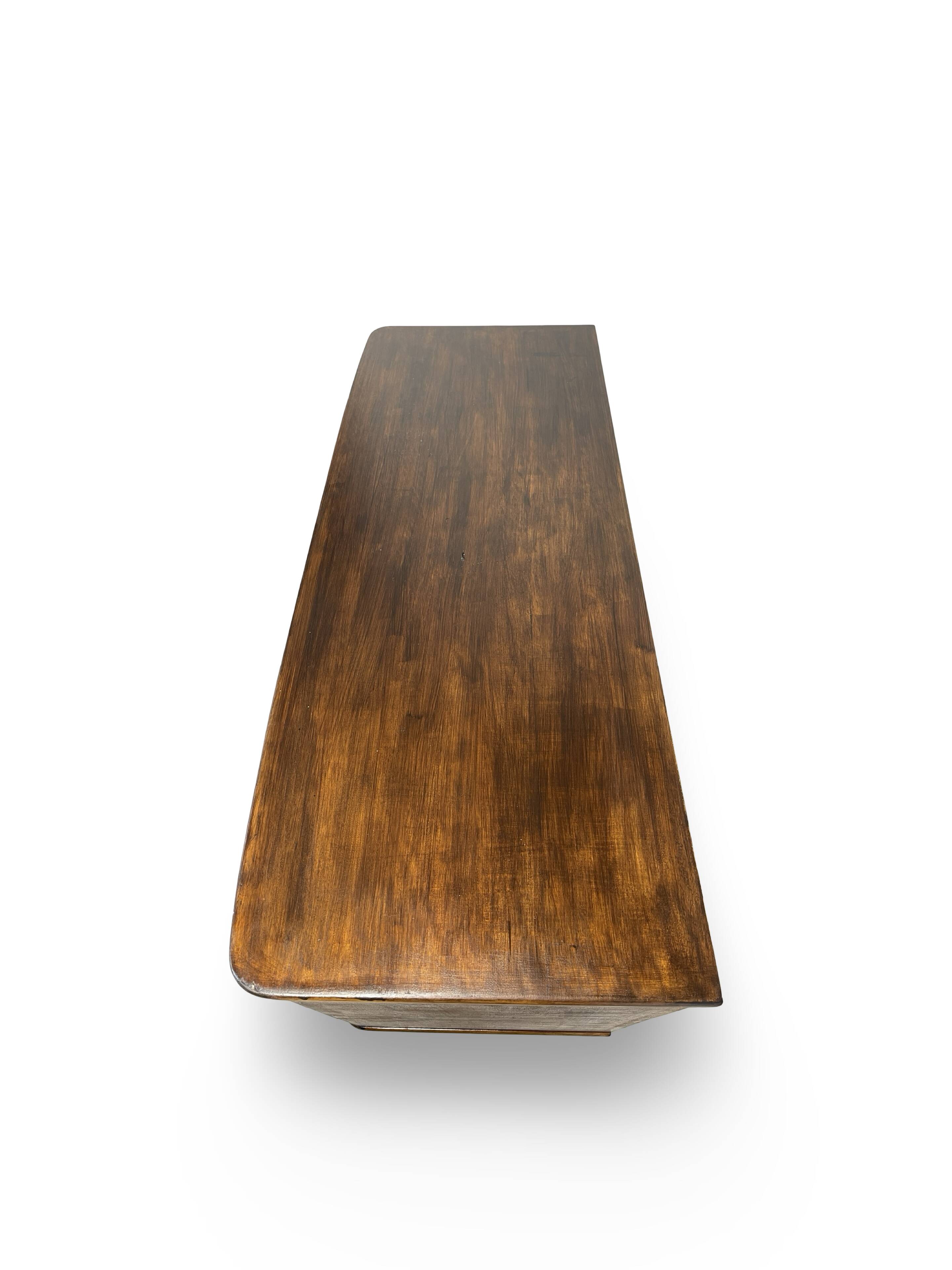 A vintage Italian chest of drawers, made of veneered walnut and solid wood,