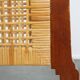 4 wooden Art Deco design dining chairs with a wicker seat and backrest