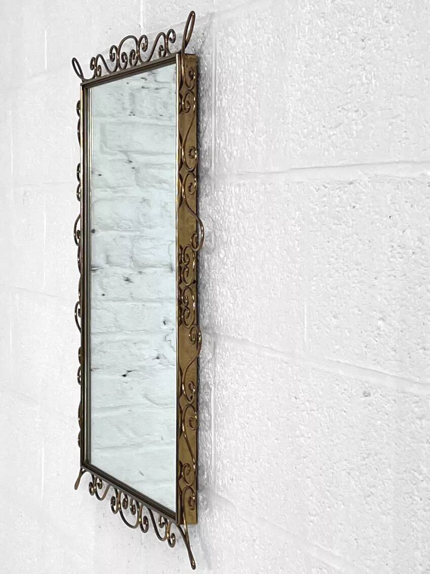 Rectangular mirror from the 50s-60s on a brass frame.