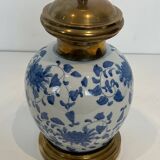 Pair of porcelain lamps with Chinese-style decorations and brass.