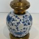 Pair of porcelain lamps with Chinese-style decorations and brass.