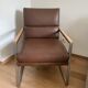 A pair genuine leather armchairs.
