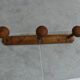 Wall-mounted coat rack made of turned wood imitating bamboo, 3 hooks.