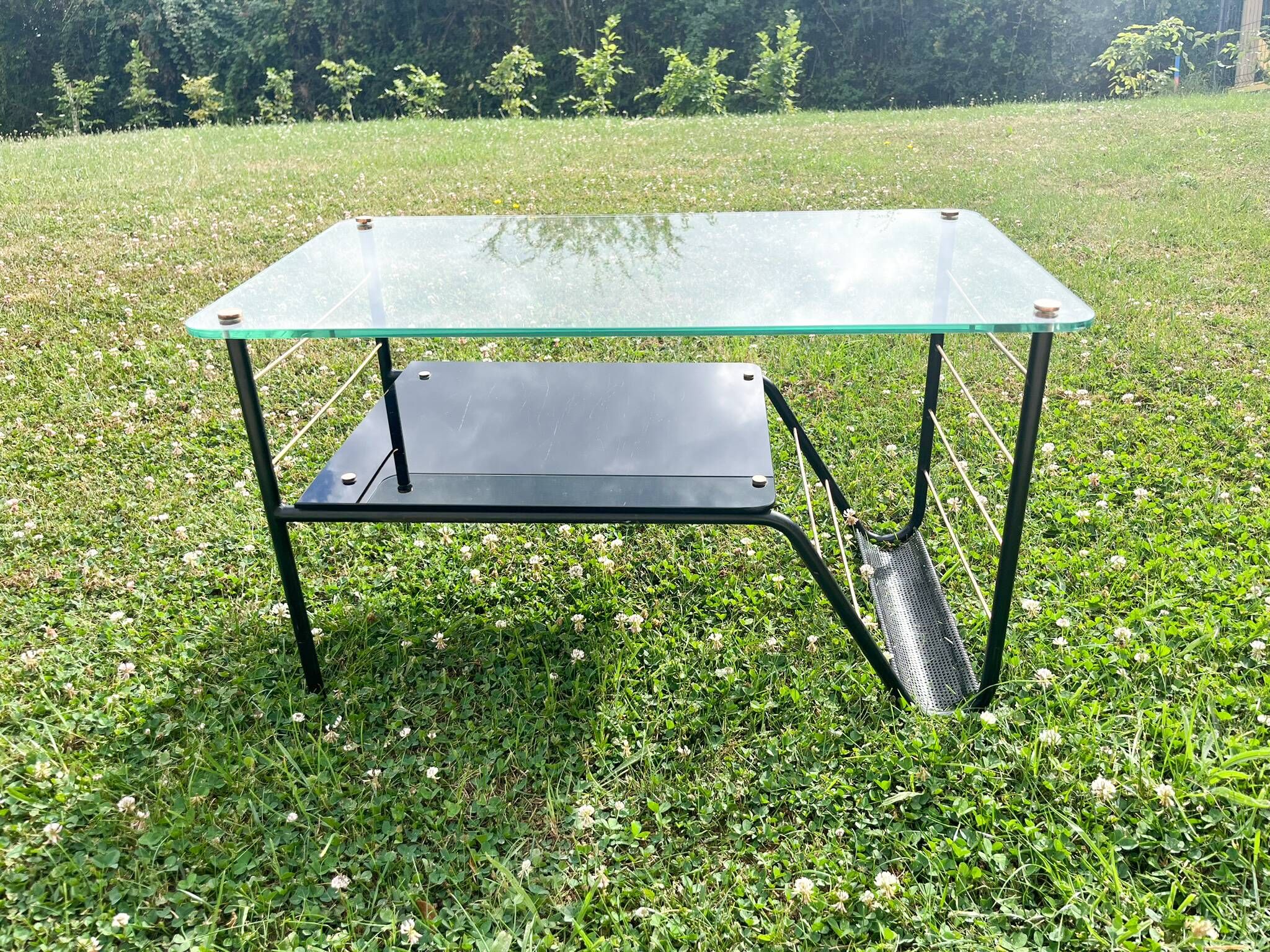 Metal and glass coffee table with magazine rack by Roche Bobois from the 1950s.