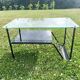 Metal and glass coffee table with magazine rack by Roche Bobois from the 1950s.