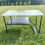 Metal and glass coffee table with magazine rack by Roche Bobois from the 1950s.