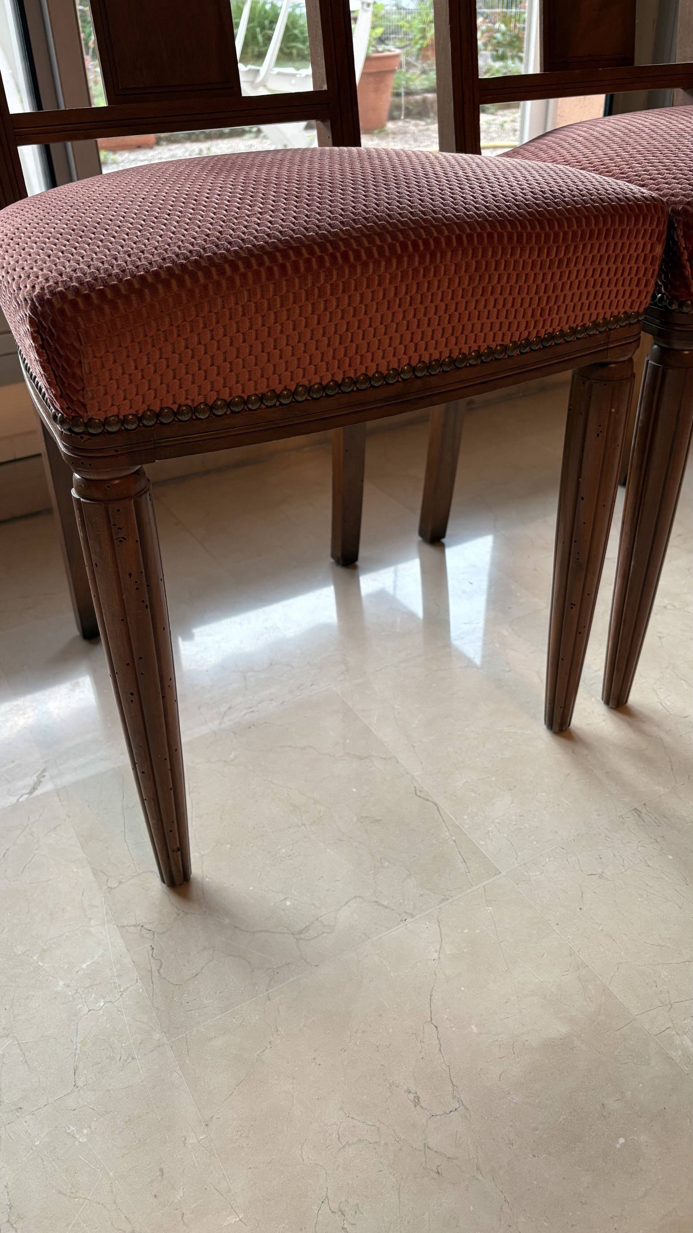 Set of 2 wooden chairs with padded seats.