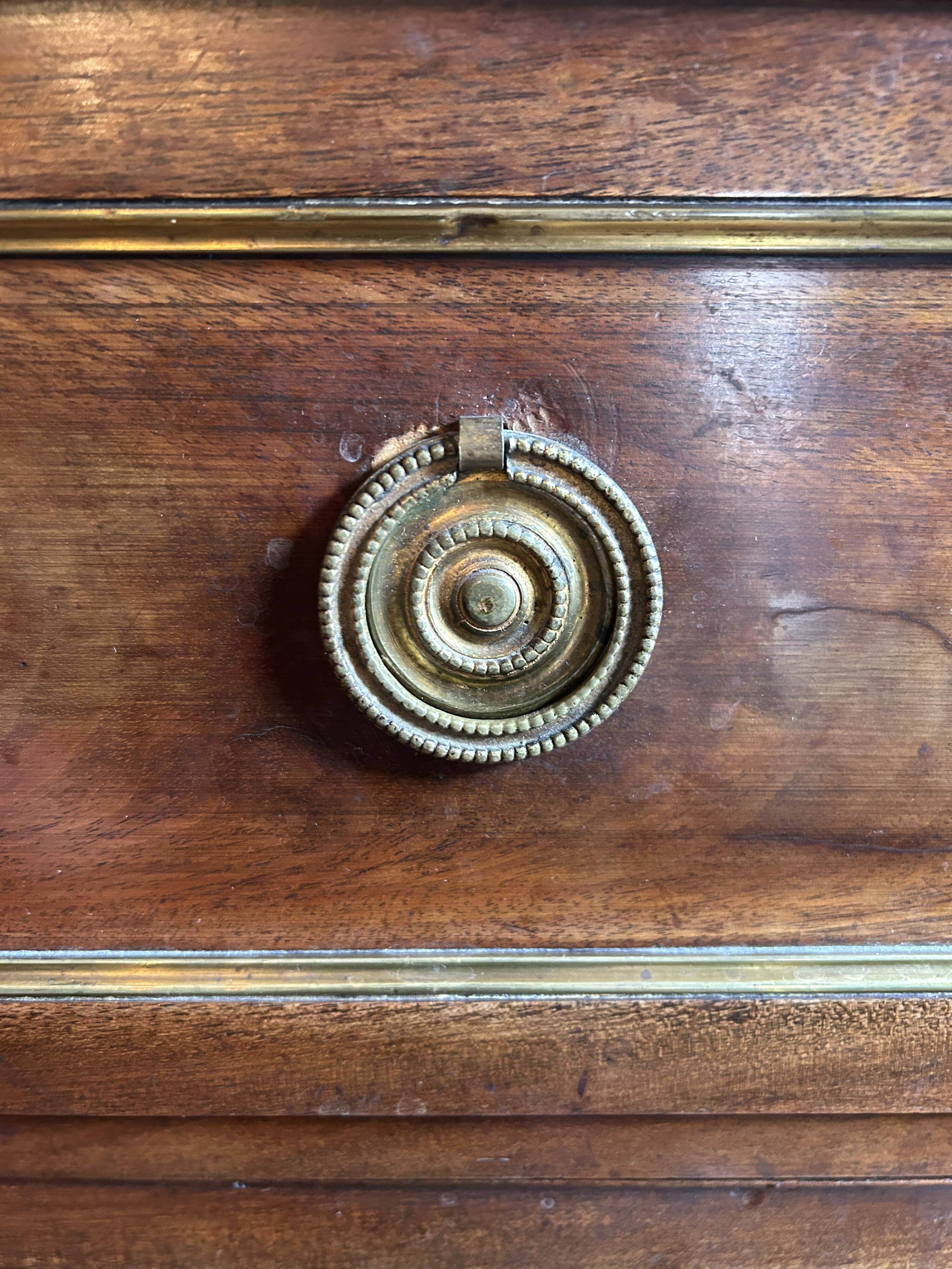 Mahogany and black marble chest of drawers, late 18th-early 19th century