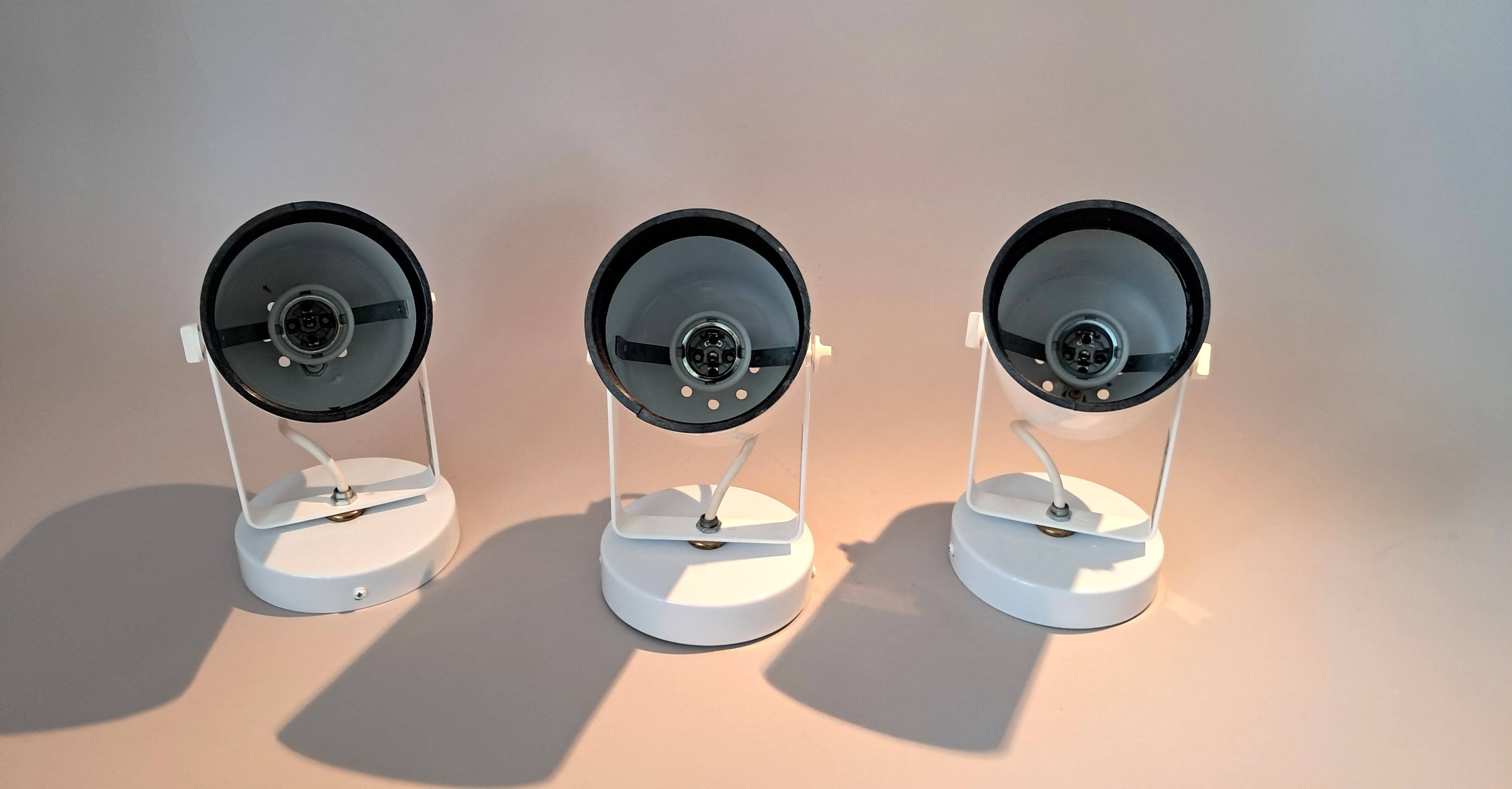 3 white lacquered metal wall lights from the 1970s.