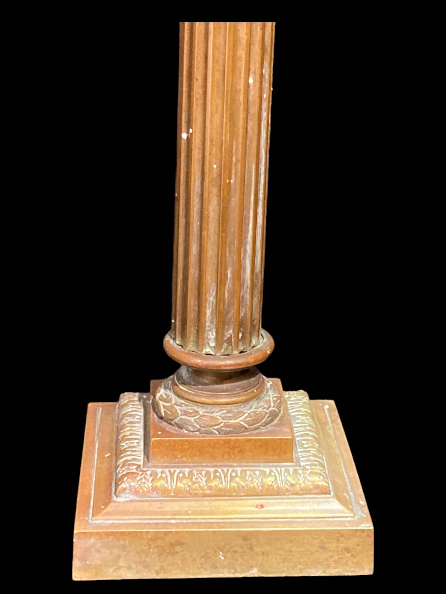 Bronze candle holder with floral motifs.