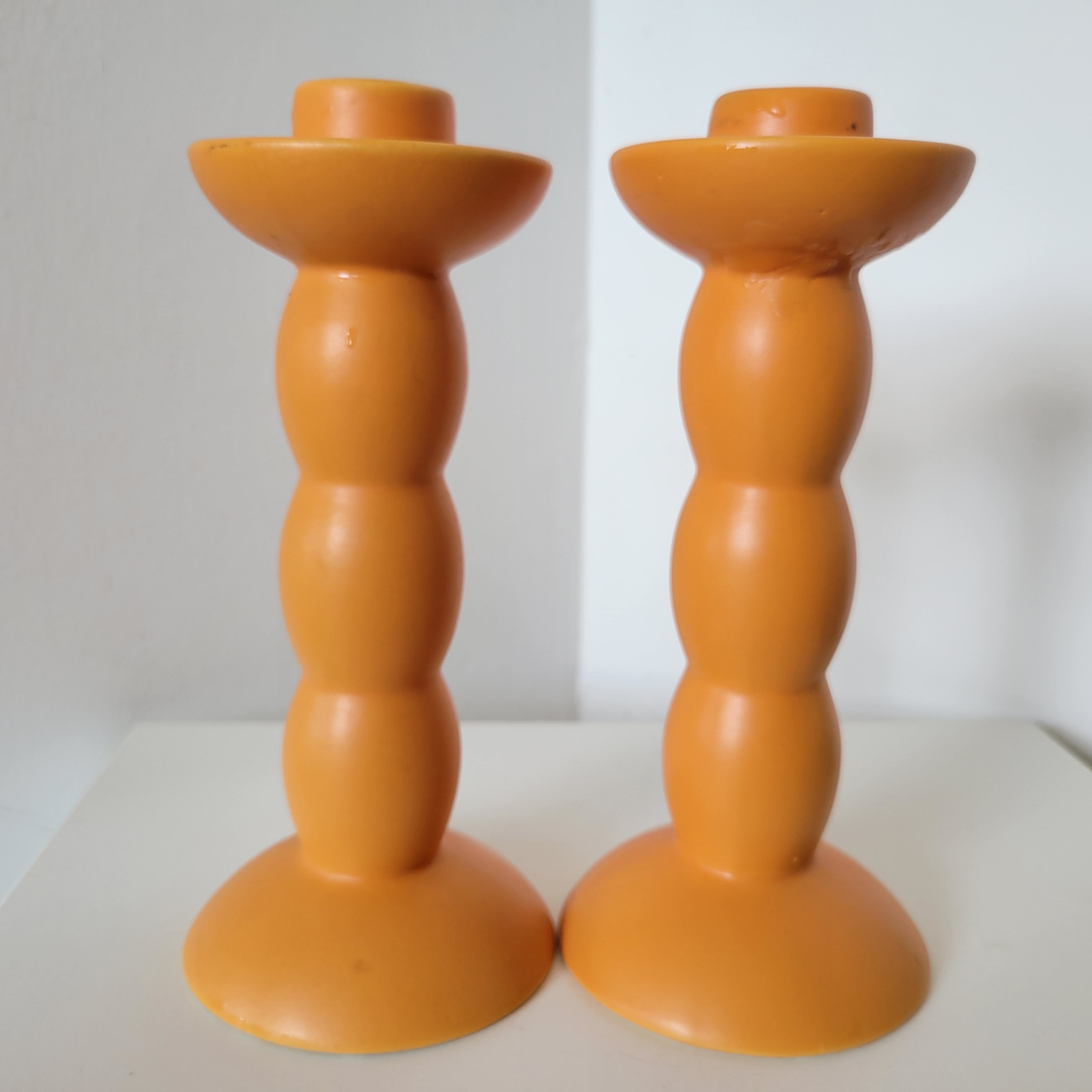 2 orange ceramic candle holders