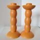 2 orange ceramic candle holders