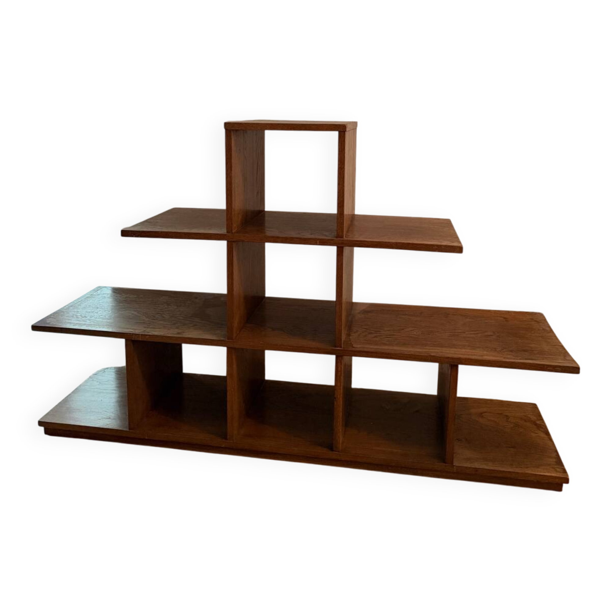 Low wooden shelf in 1960s brutalist style.