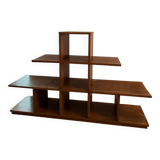 Low wooden shelf in 1960s brutalist style.