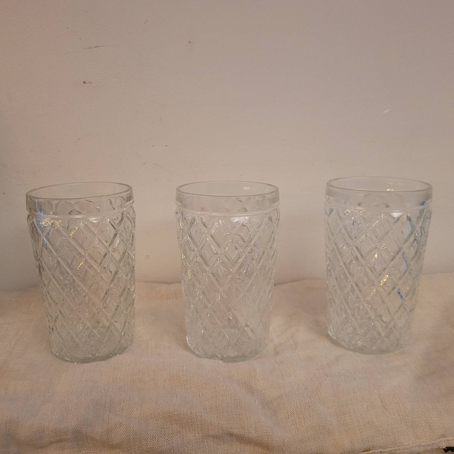 Set of three long drink glasses in pressed glass with a diamond pattern, 1960.