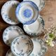 Set of 8 mismatched antique ironstone deep plates.
