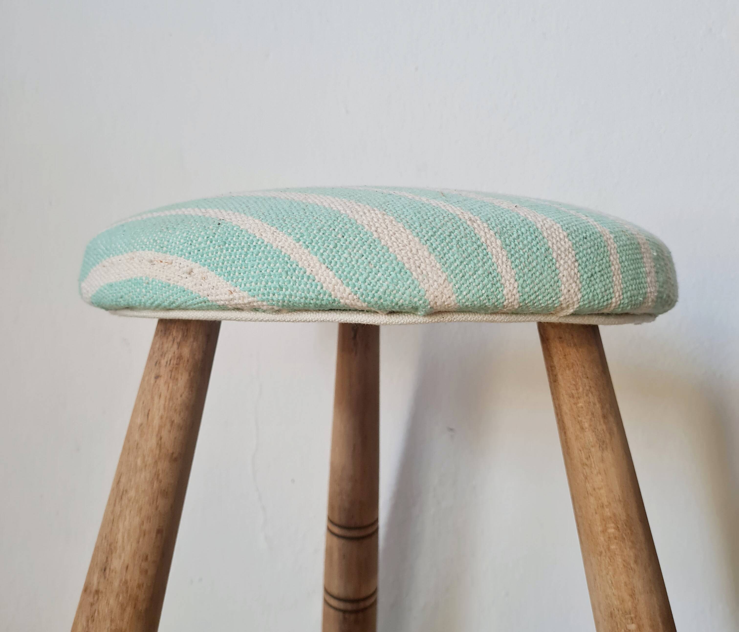 Antique tripod stool with striped seat