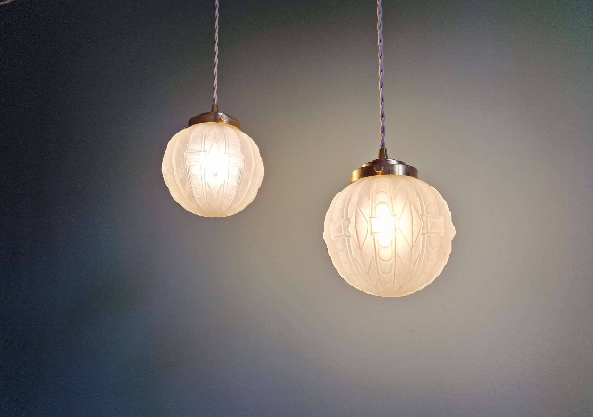 Pair of Art Deco pendant lights in pressed molded satin glass, 1920-30