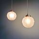 Pair of Art Deco pendant lights in pressed molded satin glass, 1920-30