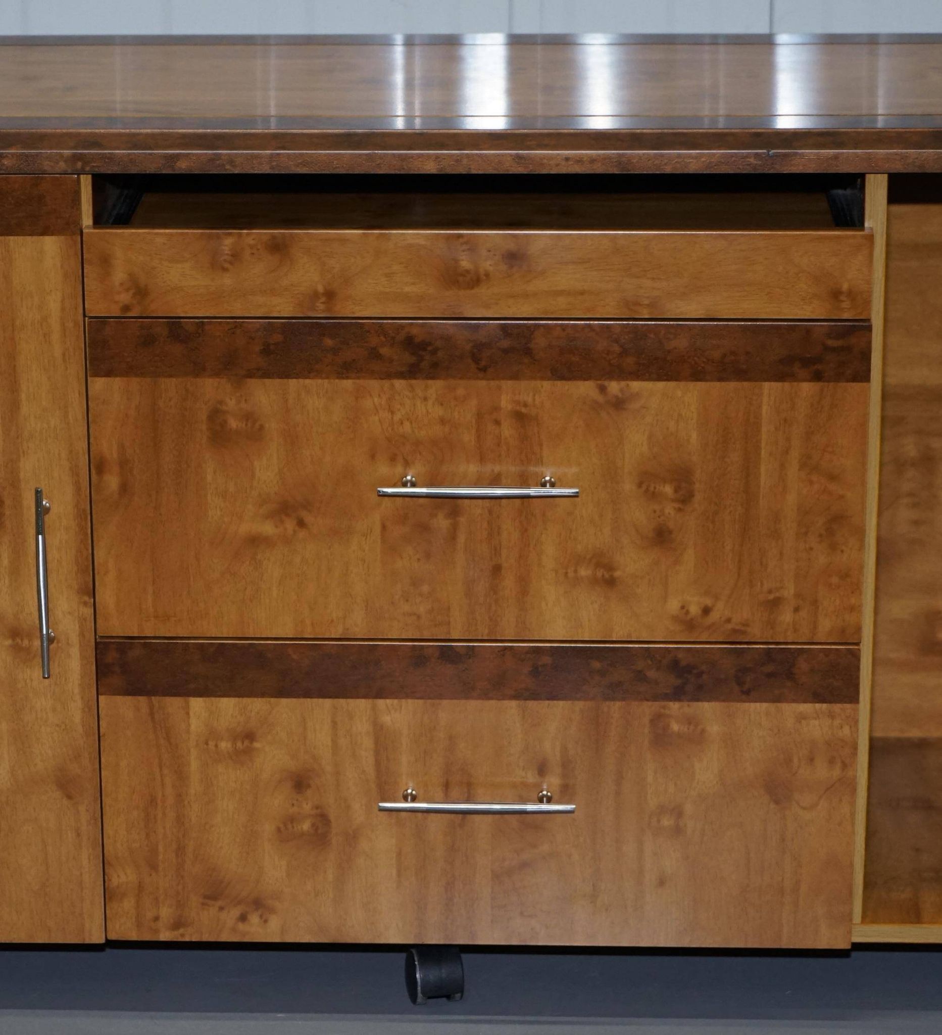 Walnut Burr buffet with drawers and wheels, part of a set.