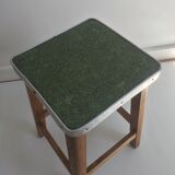 Wooden stool and green seat