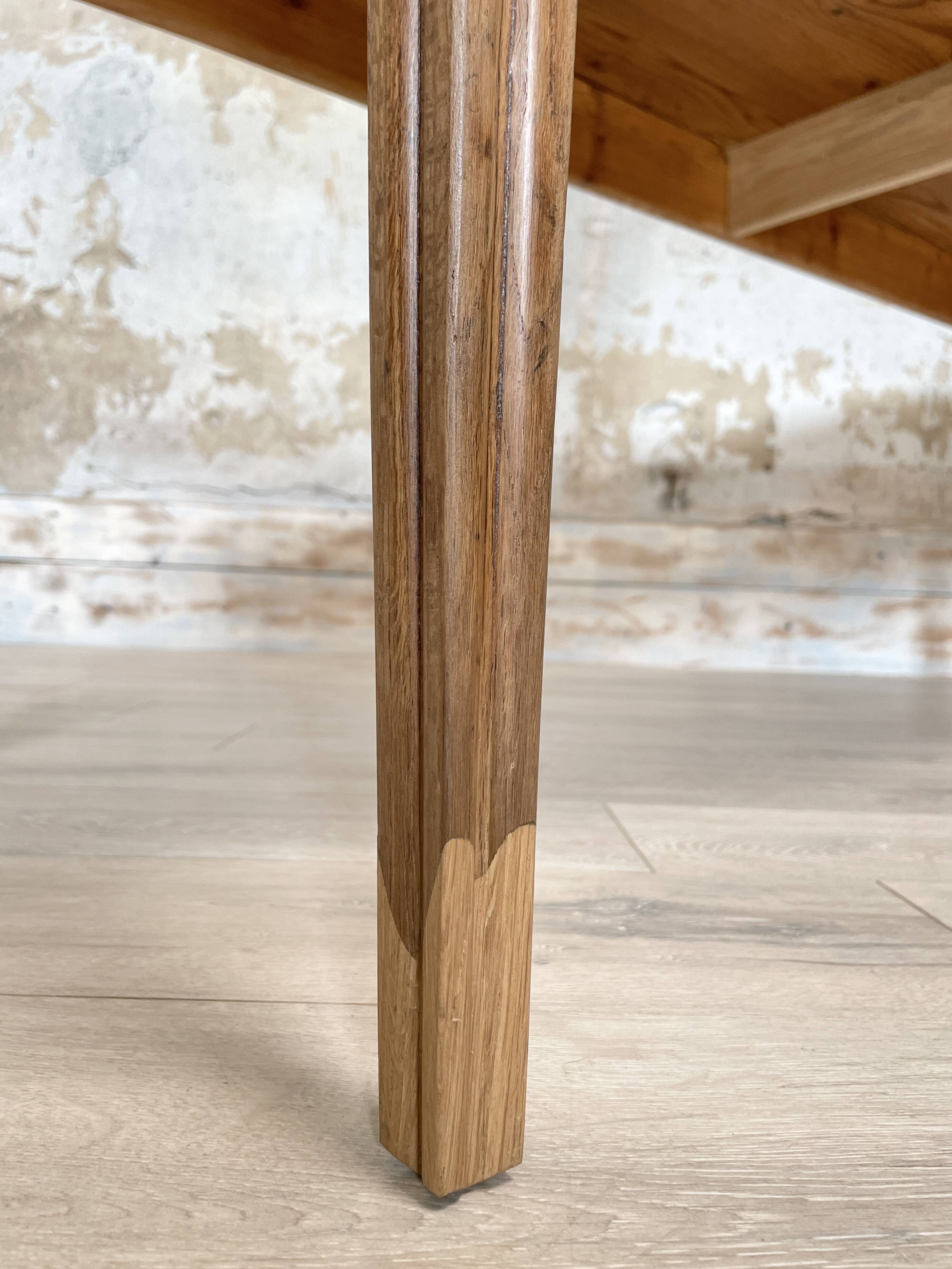 Vintage farm table with spindle legs.