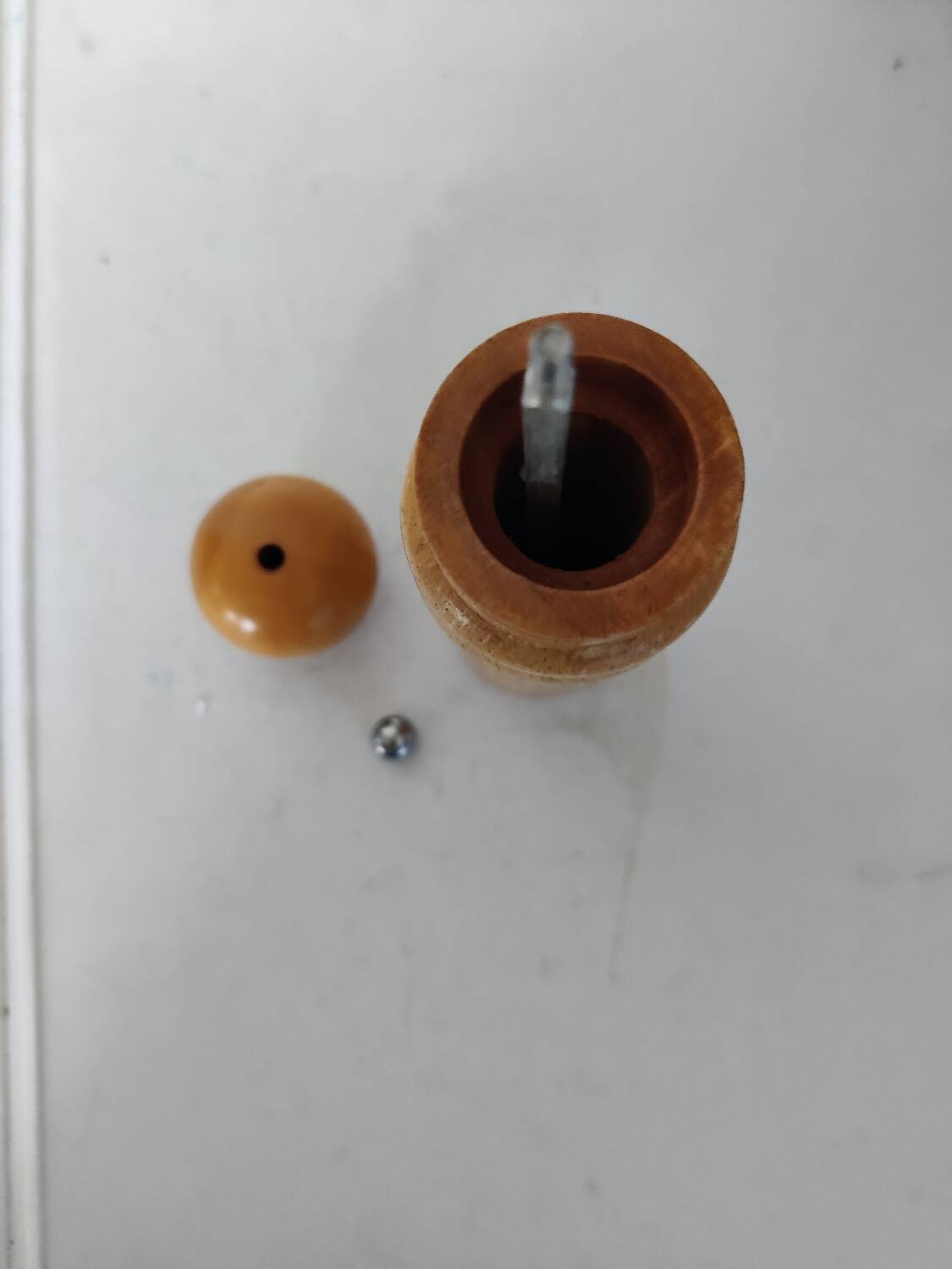 Turned wooden pepper mill