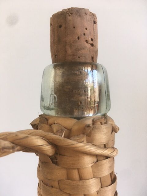 Old lady-jeanne dressed in vintage rattan