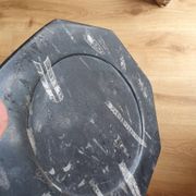 Decorative plate made of fossilised orthoceras marble.
