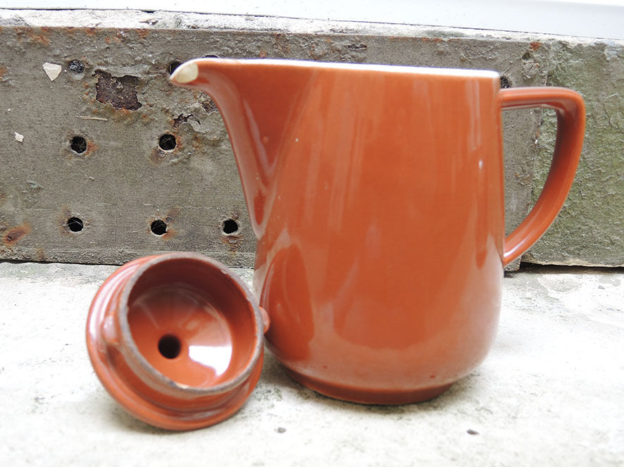 Old brown ceramic coffee maker