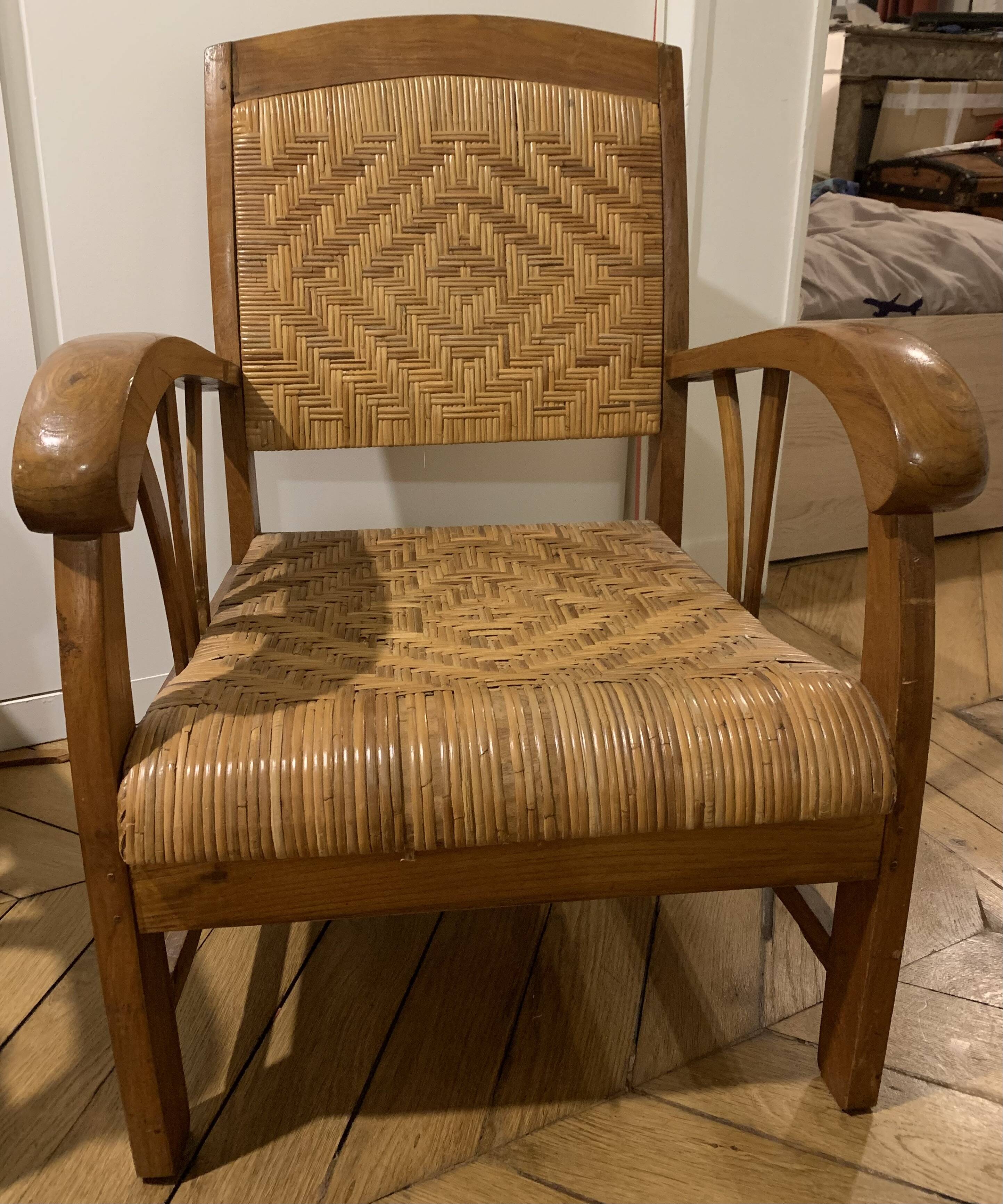 Two contemporary teak and rattan armchairs