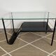 Metal and glass coffee table with magazine rack by Roche Bobois from the 1950s.