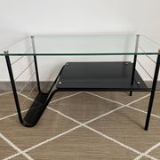 Metal and glass coffee table with magazine rack by Roche Bobois from the 1950s.